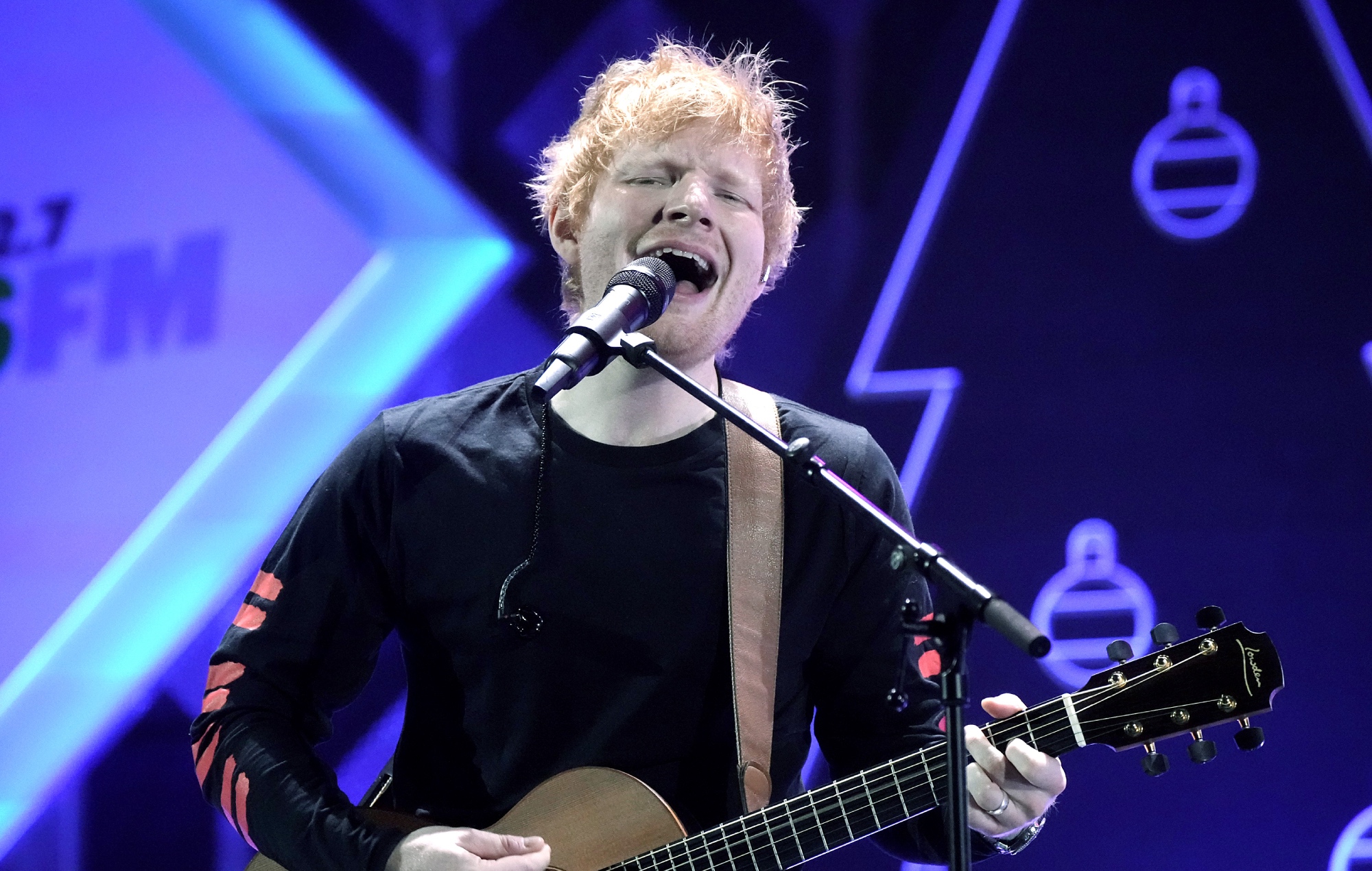 Ed Sheeran performing live onstage in 2021