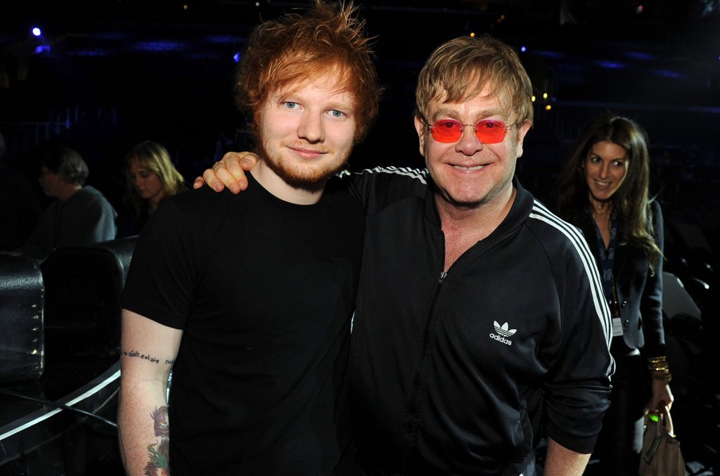 watch-ed-sheeran-and-elton-john-adorably-exchange-ugly-soccer-themed-christmas sweaters