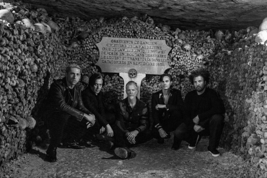 queens-of-the-stone-age-announce-‘alive-in-the-catacombs’-film